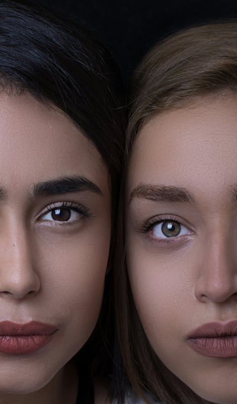 Two women's faces side by side, natural skin close up